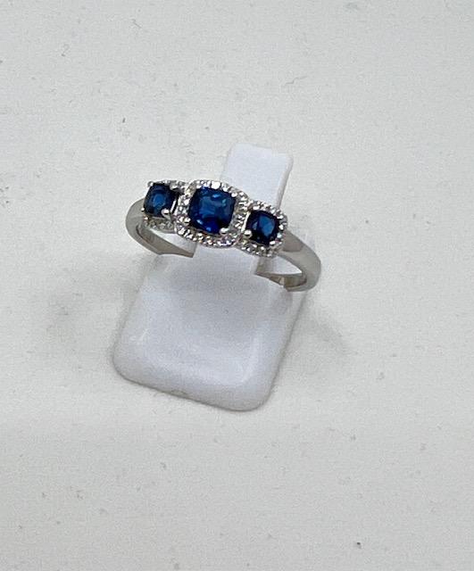 18ct White Gold Sapphire and Diamond 3 Stone Halo Ring